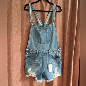 Never worn. Tags ON. Distressed Jean short Overalls size XL